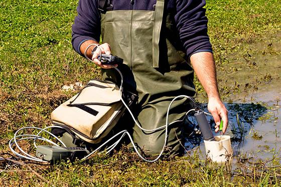 Photo of an instructor conducting an experiment on Eden Hall Campus